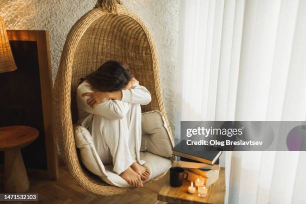 woman crying alone at home. sadness and melancholy. breakup with boyfriend - boyfriend crying stock-fotos und bilder