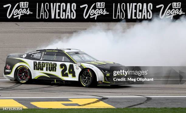 William Byron, driver of the RaptorTough.com Chevrolet, celebrates with a burnout after winning the NASCAR Cup Series Pennzoil 400 at Las Vegas Motor...