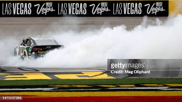 William Byron, driver of the RaptorTough.com Chevrolet, celebrates with a burnout after winning the NASCAR Cup Series Pennzoil 400 at Las Vegas Motor...