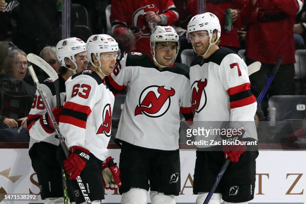 Timo Meier of the New Jersey Devils celebrates his first goal with the team with Dougie Hamilton, Jesper Bratt and Jack Hughes of the New Jersey...