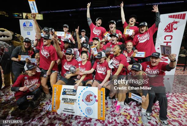 The Washington State Cougars celebrate their 65-61 victory over the UCLA Bruins to win the championship game of the Pac-12 Conference women's...