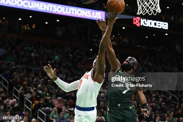 Barrett of the New York Knicks attempts a layup against Jaylen Brown of the Boston Celtics during the first quarter at the TD Garden on March 05,...