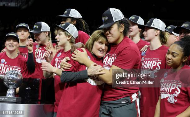 Head coach Kamie Ethridge of the Washington State Cougars embraces Ula Motuga as they celebrate their 65-61 victory over the UCLA Bruins to win the...
