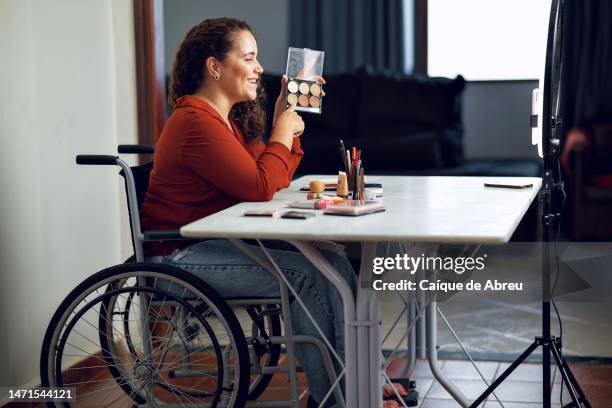 disabled young woman on a livestream about makeup - social influencer stock pictures, royalty-free photos & images