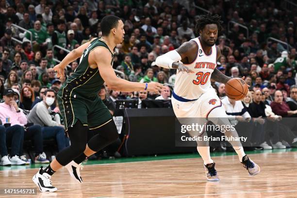 Julius Randle of the New York Knicks drives to the net against Grant Williams of the Boston Celtics during the second quarter at the TD Garden on...