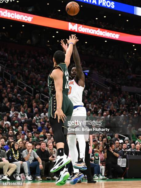 Julius Randle of the New York Knicks attempts a basket against Grant Williams of the Boston Celtics during the first quarter at the TD Garden on...