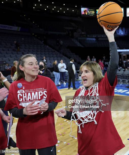 Associate head coach Laurie Koehn and head coach Kamie Ethridge of the Washington State Cougars celebrate the team's 65-61 victory over the UCLA...