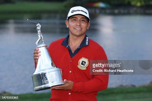 Kurt Kitayama of the United States celebrates with the trophy after winning during the final round of the Arnold Palmer Invitational presented by...