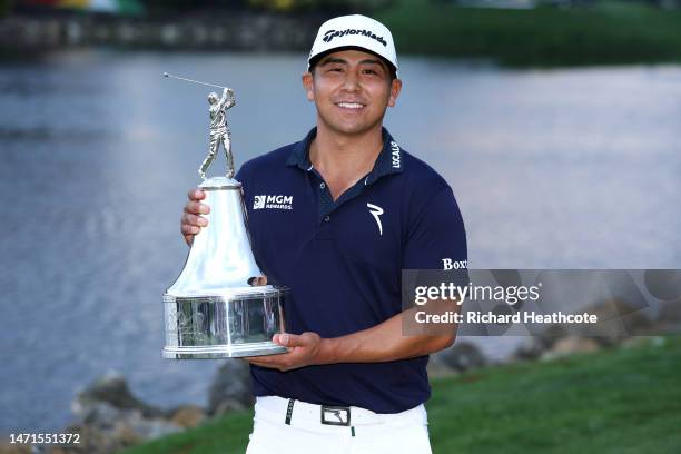 Kurt Kitayama of the United States celebrates with the trophy after winning during the final round of the Arnold Palmer Invitational presented by...