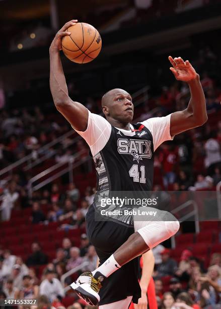 Gorgui Dieng of the San Antonio Spurs drives to the basket for a dunk against the Houston Rockets at Toyota Center on March 05, 2023 in Houston,...