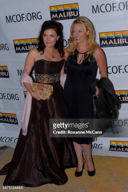 Actresses Sherilyn Fenn and Virginia Madsen arrive at the Malibu Celebration of Film Gala honoring filmmaker Robert Altman on October 7, 2006 in...