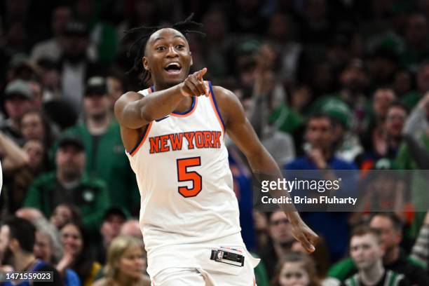 Immanuel Quickley of the New York Knicks reacts after scoring against the Boston Celtics during overtime at the TD Garden on March 05, 2023 in...
