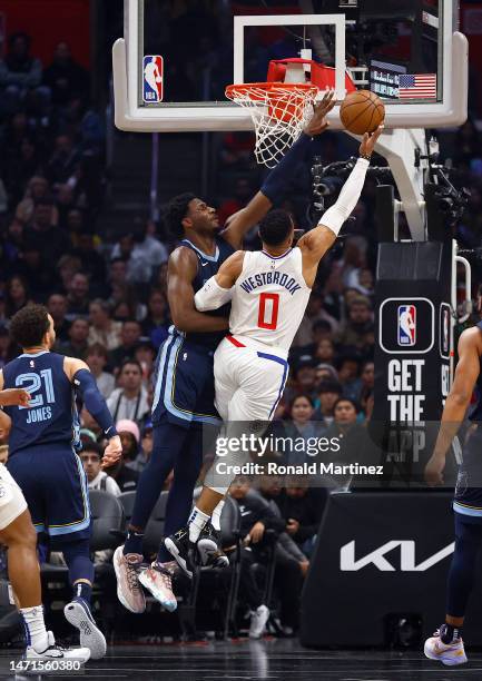 Jaren Jackson Jr. #13 of the Memphis Grizzlies blocks the shot by Russell Westbrook of the LA Clippers in the first half at Crypto.com Arena on March...