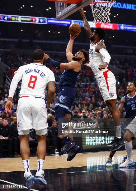 David Roddy of the Memphis Grizzlies takes a shot against Paul George of the LA Clippers in the first half at Crypto.com Arena on March 05, 2023 in...