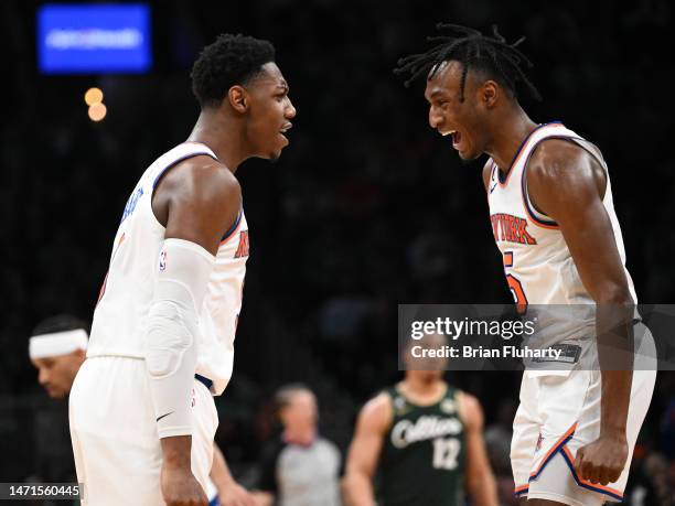 Immanuel Quickley of the New York Knicks reacts with RJ Barrett after scoring against the Boston Celtics during the fourth quarter at the TD Garden...