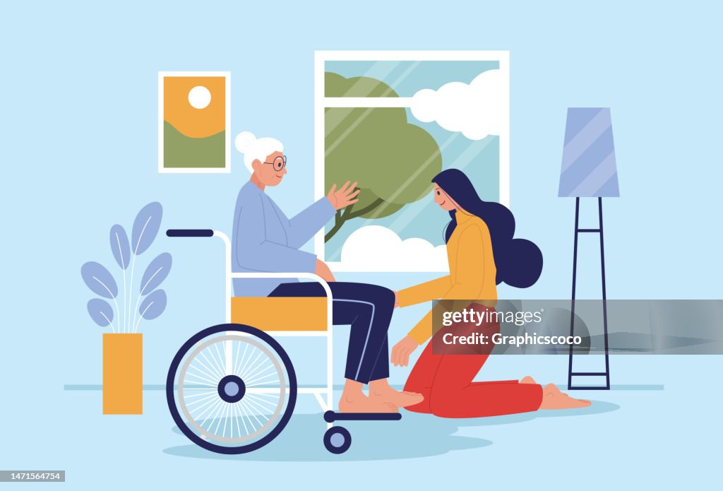 A young woman takes care of her elderly mother in her home in a wheelchair