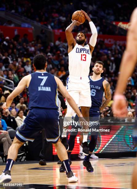 Paul George of the LA Clippers takes a shot against the Memphis Grizzlies in the second half at Crypto.com Arena on March 05, 2023 in Los Angeles,...