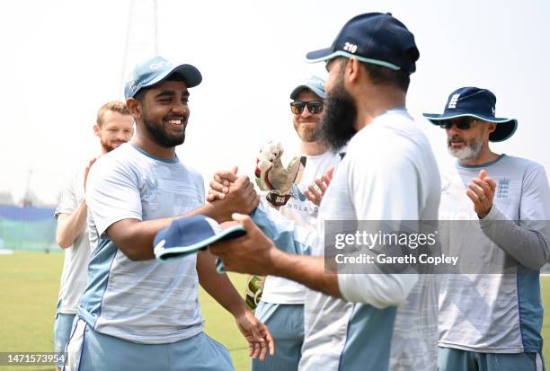 Rehan Ahmed of England receives his ODI cap from Adil Rashid during the 3rd One Day International between Bangladesh and England at Zahur Ahmed...