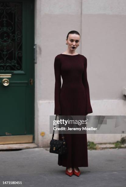 Mary Leest is seen wearing a dark red long dress, red heels and a black handbag outside Lanvin show during the Paris Fashion Week - Womenswear Fall...