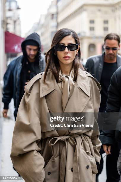 Gilda Ambrosio wears beige oversized trench coat outside Balenciaga Paris Fashion Week - Womenswear Fall Winter 2023 2024 : Day Seven on March 05,...