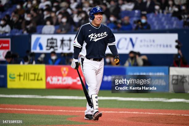 Outfielder Hyun Soo Kim of Korea reacts after flying out in the ninth inning during the World Baseball Classic exhibition game between Korea and Orix...