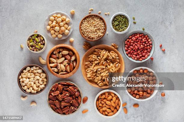 various nuts and seeds - brazil nut stock pictures, royalty-free photos & images