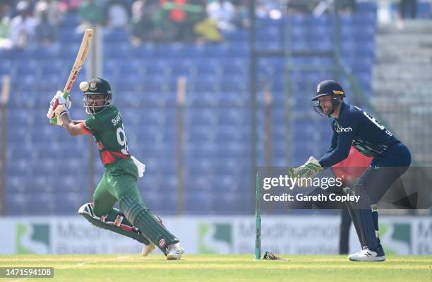 Bangladesh batsman Najmul Hossain Shanto hits out watched by Jos Buttler during the 3rd ODI between Bangladesh and England at Zahur Ahmed Chowdhury...