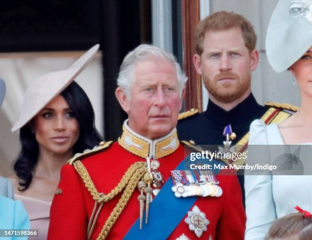 Meghan, Duchess of Sussex, Prince Charles, Prince of Wales and Prince Harry, Duke of Sussex stand on the balcony of Buckingham Palace during Trooping...