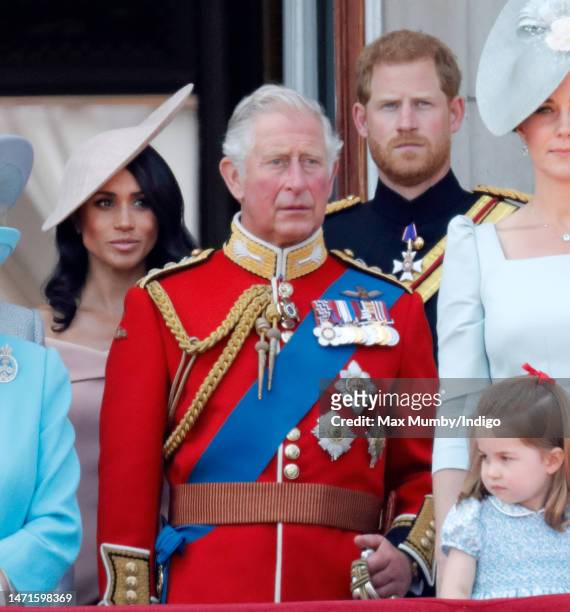 Meghan, Duchess of Sussex, Prince Charles, Prince of Wales and Prince Harry, Duke of Sussex stand on the balcony of Buckingham Palace during Trooping...