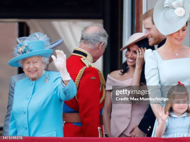 Queen Elizabeth II, Prince Charles, Prince of Wales, Meghan, Duchess of Sussex and Prince Harry, Duke of Sussex stand on the balcony of Buckingham...