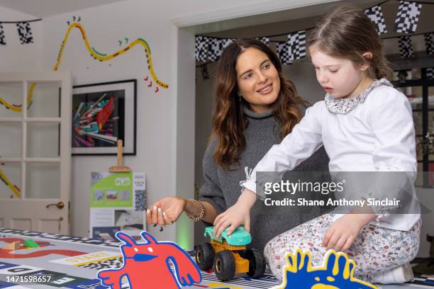 Binky Felstead and Daughter attend the opening of Disney's Wonder-ful Playhouse Pop-Up on March 05, 2023 in London, England.