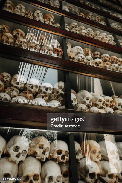 cambodia, phnom penh, choeung ek genocidal center, skulls - phnom penh stock pictures, royalty-free photos & images