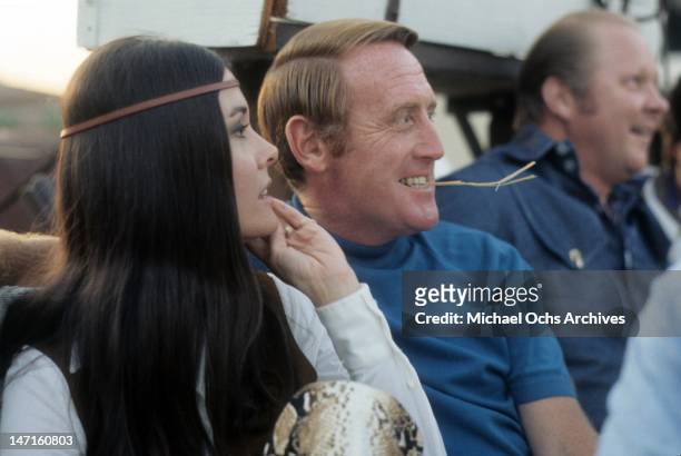 Broadcaster Vince Scully and his wife Joan Crawford look on circa July, 1970 in Los Angeles, California.