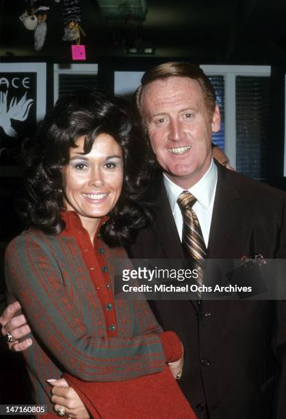 Broadcaster Vince Scully and his wife Joan Crawford poses for a portrait circa December, 1970 in Los Angeles, California.