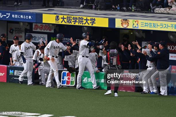 Designated hitter Shohei Ohtani of Japan celebrates with teammates after hitting a three run home run in the third inning during the World Baseball...