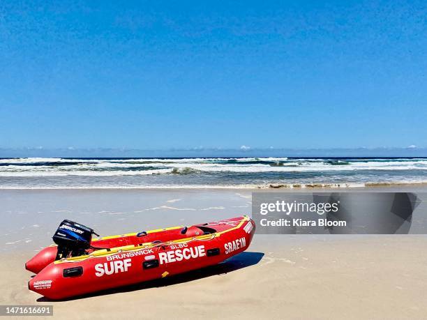 surf rescue motor boat at beach - surf rescue stock pictures, royalty-free photos & images