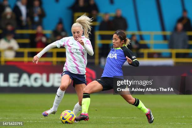 Mana Iwabuchi of Tottenham Hotspur is challenged by Chloe Kelly of Manchester City during the FA Women's Super League match between Manchester City...