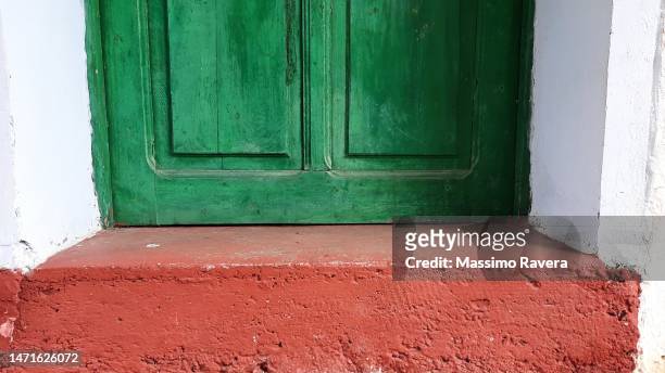 green wooden door - painted brick house stock pictures, royalty-free photos & images