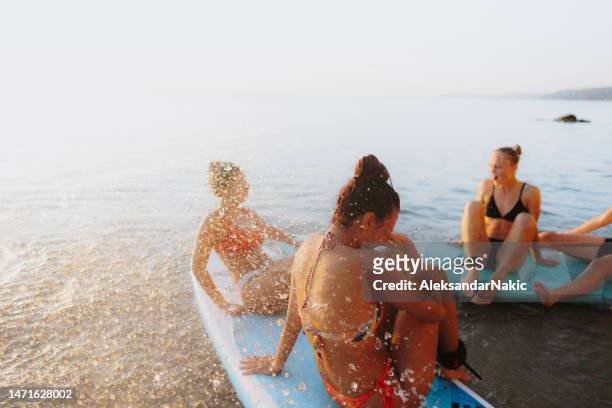 suping and swimming - sup stock pictures, royalty-free photos & images