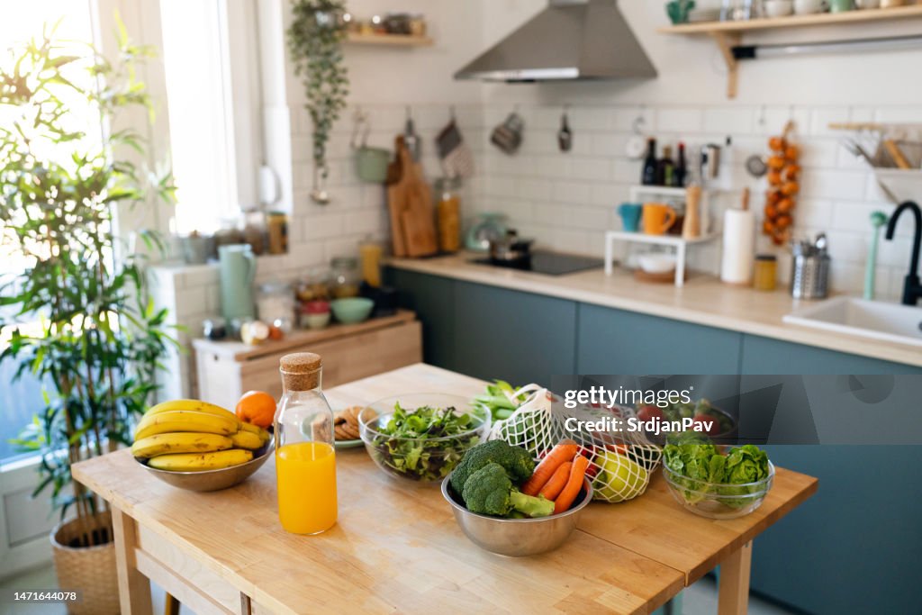 Fresh fruit and vegetables on the kitchen island