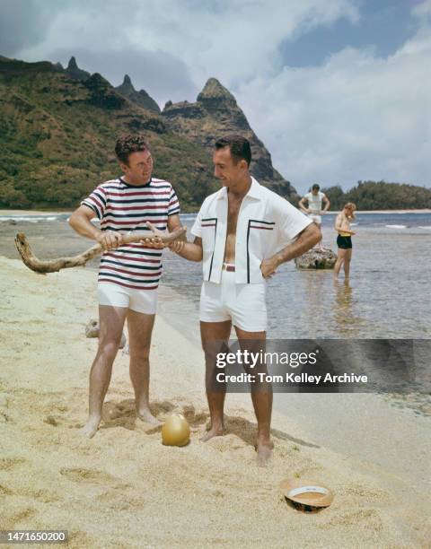 American golfer Ken Venturi with basketball player Bob Cousy, Hawaii, 1962. They are modelling sportswear by Jantzen.