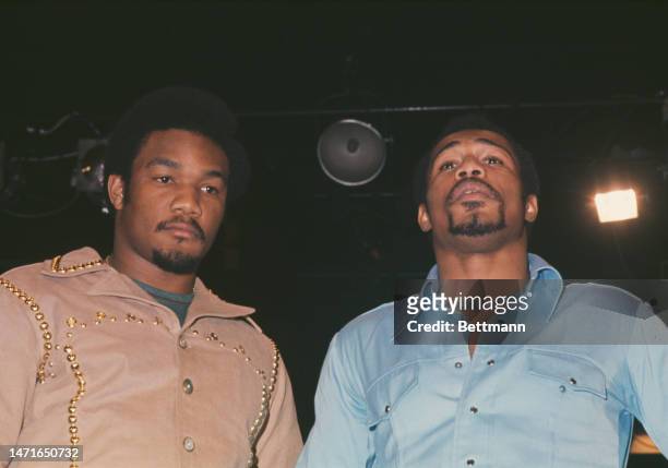World Heavyweight Champion George Foreman poses with fellow boxer Ken Norton in Madison Square Garden, New York, on January 27th, 1974. The men are...
