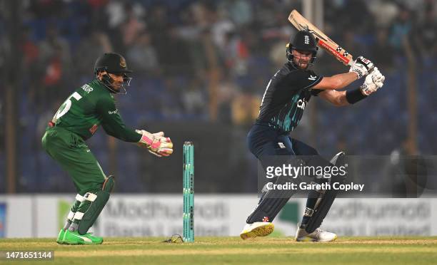 England batsman Chris Woakes in batting action watched by Mushfiqr Rahim during the 3rd ODI between Bangladesh and England at Zahur Ahmed Chowdhury...
