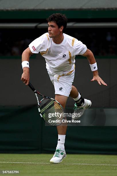 Jamie Baker of Great Britain in action during his Gentlemen's Singles first round match against Andy Roddick of the USA on day two of the Wimbledon...