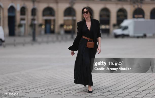 Patricia Wirschke seen wearing Bottega Veneta brown sunglasses, Zara black button v-neck body, Max Mara black pleated long skirt, Tagliatore black...