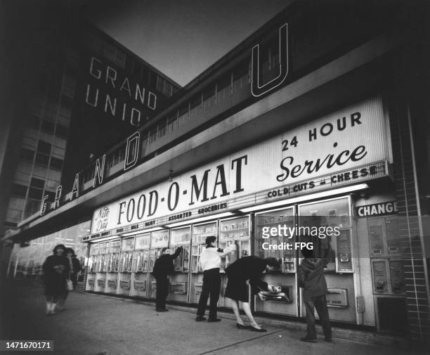 The shoppers at the coin-operated vending machines of the 'Food-O-Mat' at the front of the Grand Union flagship supermarket in East Paterson , New...
