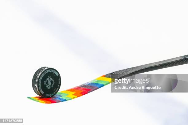 Mathieu Joseph of the Ottawa Senators juggles a puck during warmup on Pride Night prior to a game against the Columbus Blue Jackets at Canadian Tire...
