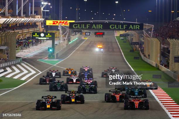 Max Verstappen of the Netherlands driving the Oracle Red Bull Racing RB19. And Charles Leclerc of Monaco driving the Ferrari SF-23 lead the field...