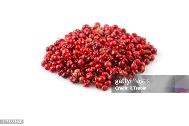 red peppercorns seeds isolated on white background - red peppercorns stock pictures, royalty-free photos & images