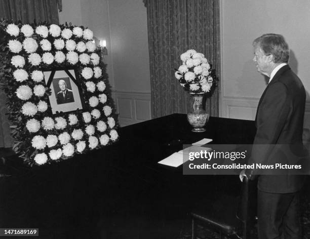 President Jimmy Carter pays his respects at a memorial for Japan's Prime Minister Masayoshi Ohira at the Japanese Embassy, Washington DC, June 16,...